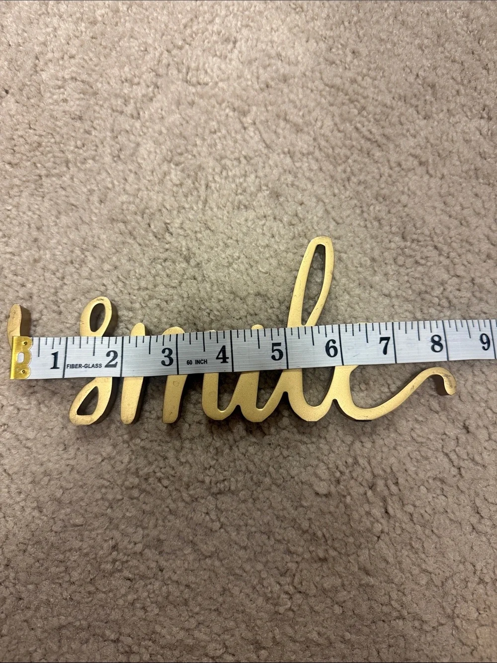 “Smile” Gold Tone Metal Decor Script Sign